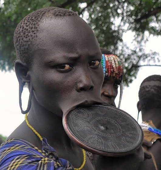  The Bizarre Fashion Tradition Of Lip Plating in Africa